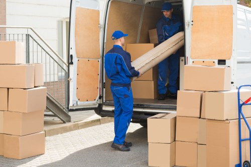 Movers carrying out a safe removal task with protective equipment