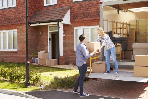 Moving team planning a Dulwich home removal on a residential street