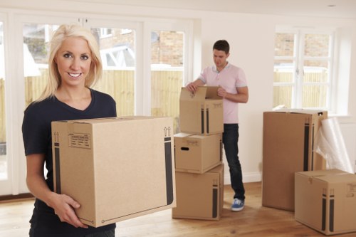 Professional packing team organising boxes in a Dulwich home