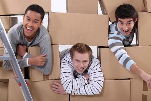 Removal van and moving team in a Dulwich residential street