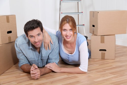 Professional movers handling furniture in a Dulwich house