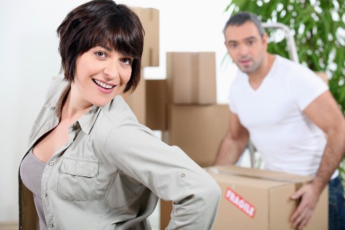 Removal team handling furniture during a house move in Dulwich